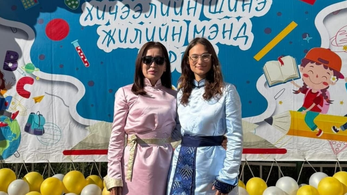 Peace Corps Volunteer and Counterpart posing on the First Day of School