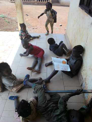 Students in Cameroon reading the books created by the students in California