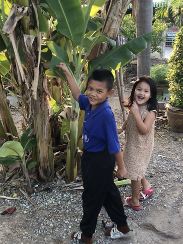 My nickname, Bai Dtong, means big banana leaves. Some cute neighborhood kids started to do our secret hand shake with REAL bi