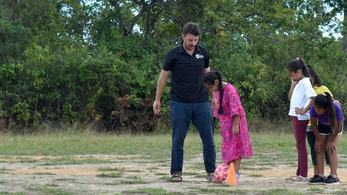 PCV Joey teaching soccer to children in Belize.