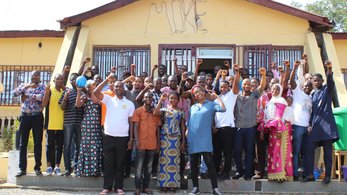 Large group of people in front of building