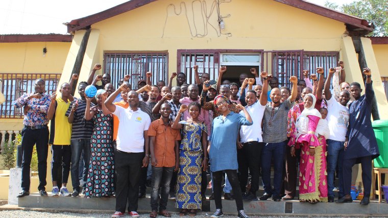 Large group of people in front of building