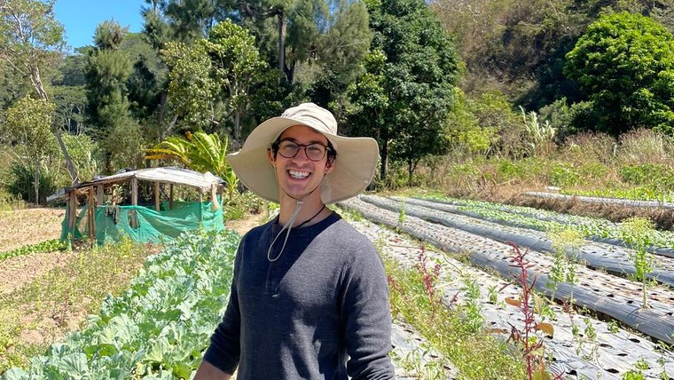 Sina helps out on a local farm in Timor Leste.