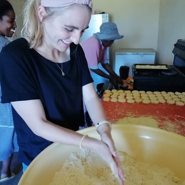 Volunteer baking in South Africa.