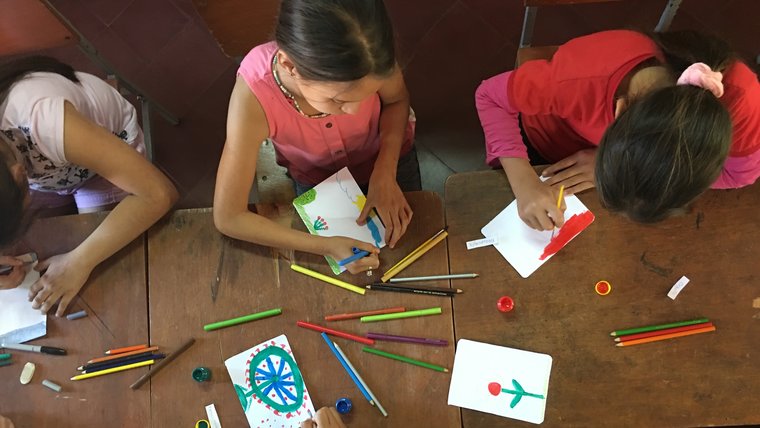 Members of the Art Club at the Escuela Basica draw/paint their interpretation of an emotion.
