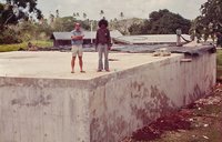 .      A Tongan construction foreman and I are standing on a concrete reservoir I designed.