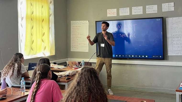Benjamin engages students in Albania.