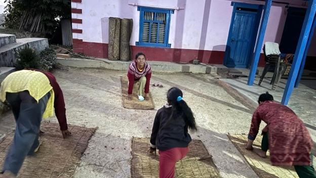 Bhuwan teaches a yoga class in her Nepali community.