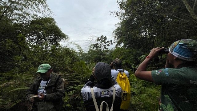Olivia has learned to love birdwatching in Ecuador.