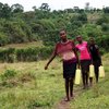 Blue House girls hauling water from the spring.jpg