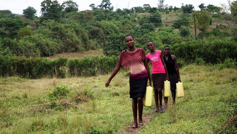 Blue House girls hauling water from the spring.jpg