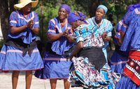Women dance in traditional Botswanan dress