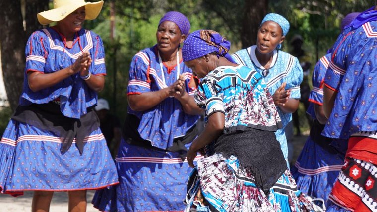 Women dance in traditional Botswanan dress