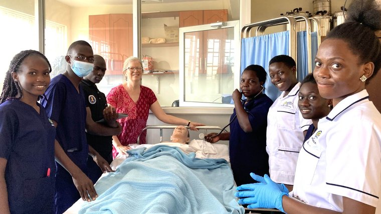 Peace Corps Uganda Volunteer Brenda poses with nursing students