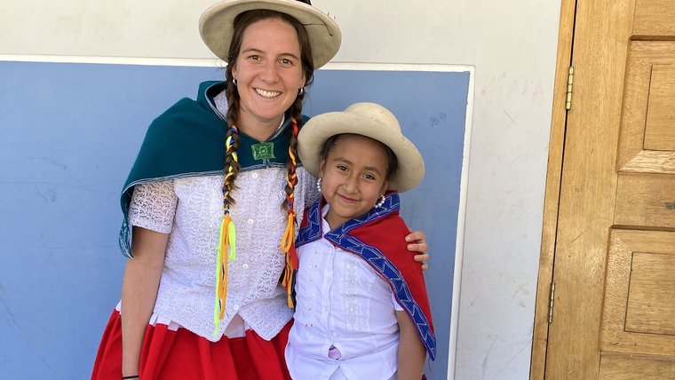 Volunteer in Peru with a young community member.
