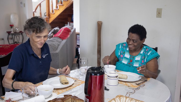 Carol dines with her host "mother," Elma.