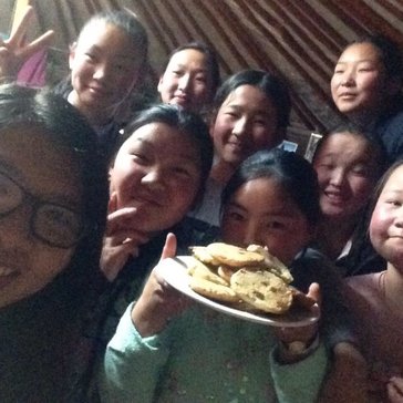 Learning how to make cookies in English club.