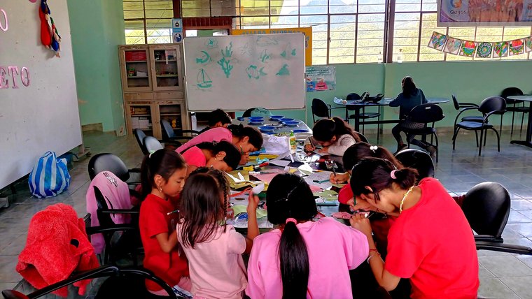 Children create art in a new community center in Ecuador.