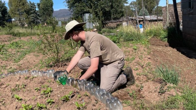 Volunteer Chris B. gardening in Tanzania