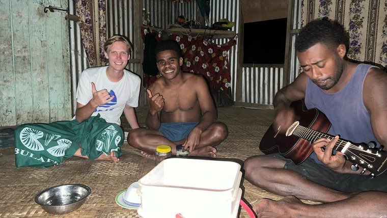 Declan spends a lot of time playing music with community members in Fiji.
