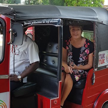 Country Director Peace Corps Sri Lanka seated inside a tuk-tuk (three wheeler)