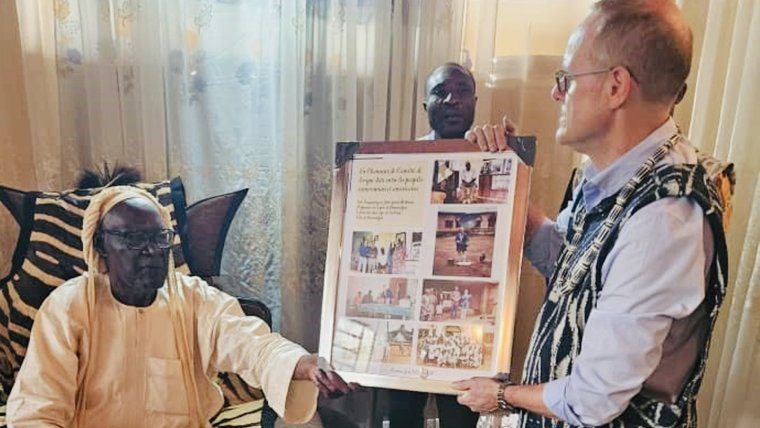 The chief of Bamendjou welcomes John back to the village where he served nearly 30 years prior.