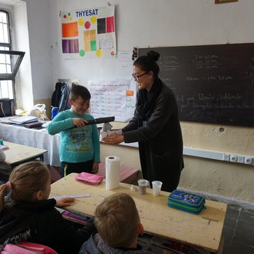 Minju delivers an oral health hygiene lesson to 4th grade class in Albania.