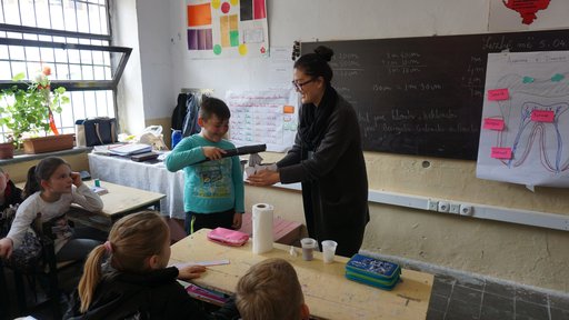Minju delivers an oral health hygiene lesson to 4th grade class in Albania.