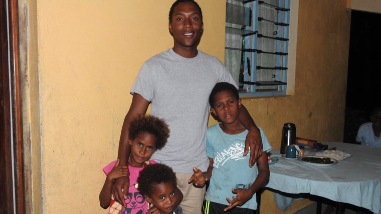 Keevon with his host family.