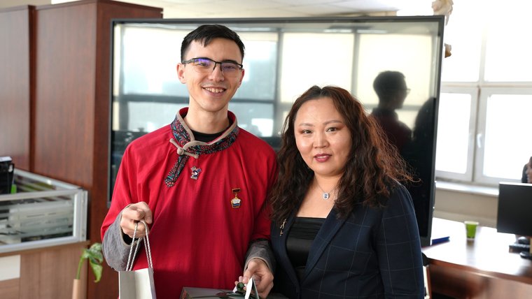 Peace Corps Volunteer Daniel L. with his counterpart after receiving award