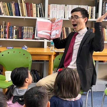Peace Corps Volunteer Daniel L reads to children in Mongolia