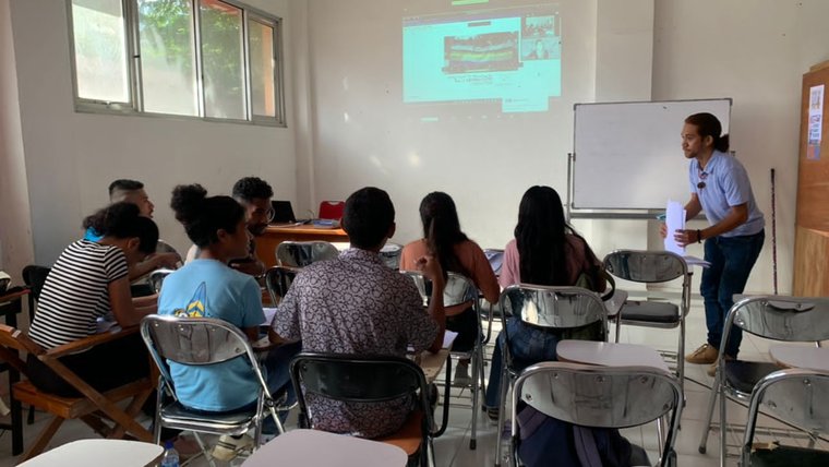 students listen to an instructor via Zoom