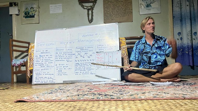 Declan facilitates discussions about financial literacy and entrepreneurship in Fiji.