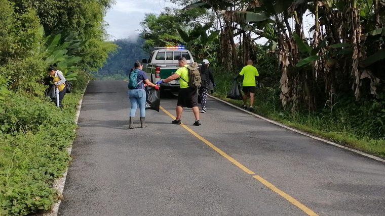 Dena walks along a road in Panama