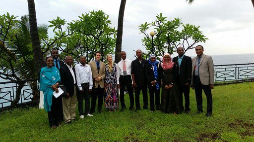 Director Carrie Hessler-Radelet visits with Peace Corps Comoros staff members, including Haina.