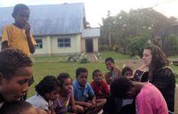 Playing "Let it Go" from Disney's Frozen in my host village