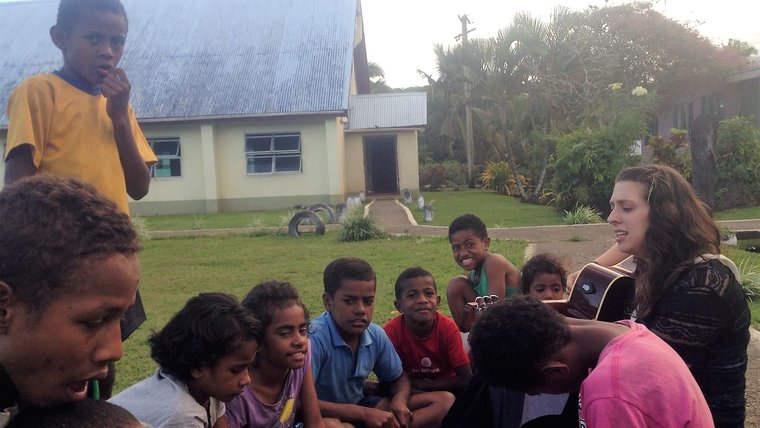 Playing "Let it Go" from Disney's Frozen in my host village