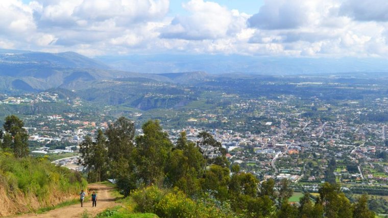 Scenic photo of lush scenery and a distant village
