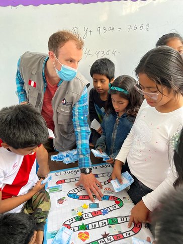 Ryan provides financial education for community members in Peru.