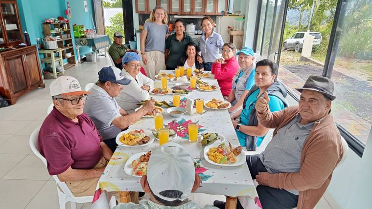 Elderly adults participate in cooking and nutrition classes as part of a community garden project.