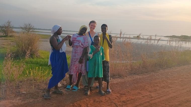 Ella with her host sisters and at a local river in Senegal.