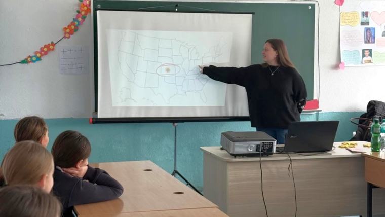 Emma makes a presentation about her home state of Kansas at the American Corner