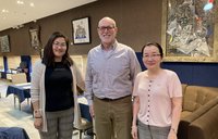 PCV John L stands with two Mongolian professors.