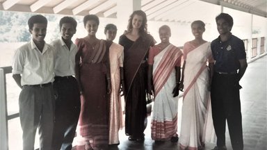 PCV dressed in saree the Professional standard attire for a female teacher posing with her counterpart males dressed in shirt