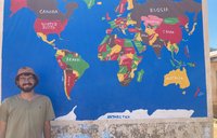Photo of PCV in front of world map