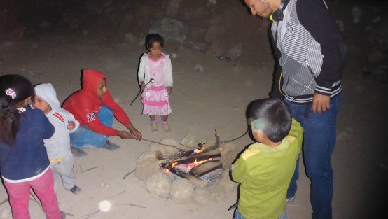 Friends and neighbors roasting their marshmallows.