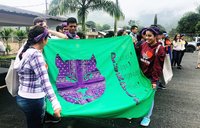 GLOW/BRO Team Members Displaying their Custom Flag