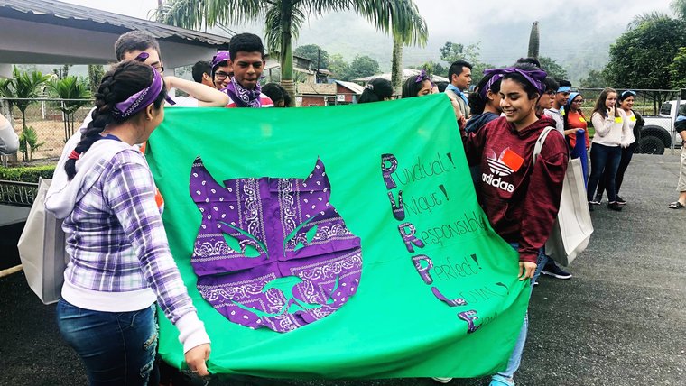 GLOW/BRO Team Members Displaying their Custom Flag