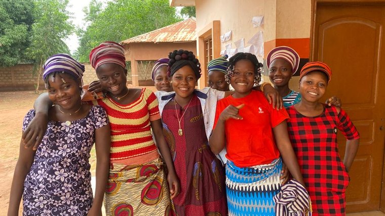 Beninese participants in Camp GLOW, which includes activities on leadership, public speaking, and health.