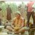 A male Volunteer in the mid-70s shares a meal in his Burkina Faso community.
